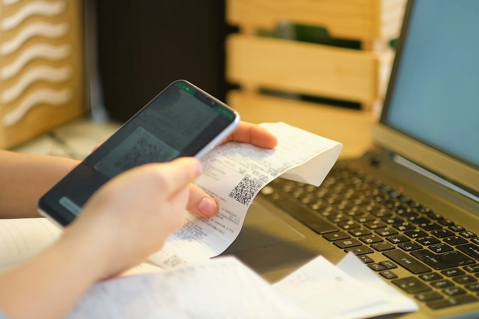 woman scans store receipts